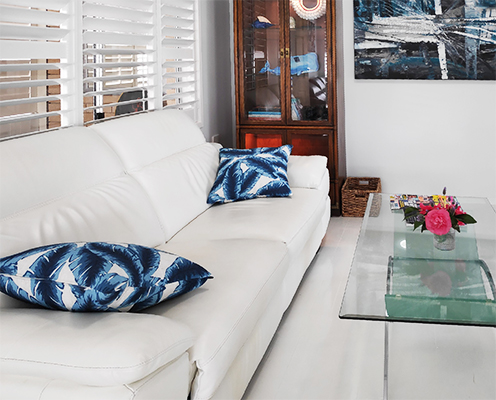 White leather sofa with coffee table